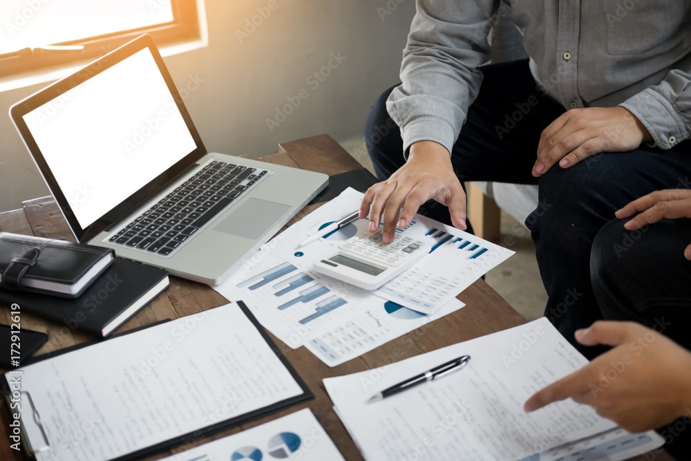 Administrator business man financial inspector and secretary making report, calculating balance. Internal Revenue Service checking document. Audit concept. Administrator business man financial inspector and secretary making report, calculating balance. Internal Revenue Service checking document. Audit concept.