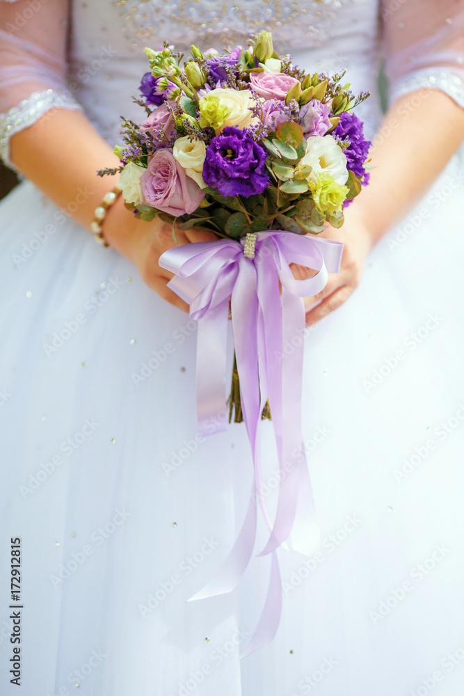 Bride in white dress holding wedding bouquet. Marriage concept Bride in white dress holding wedding bouquet. Marriage concept