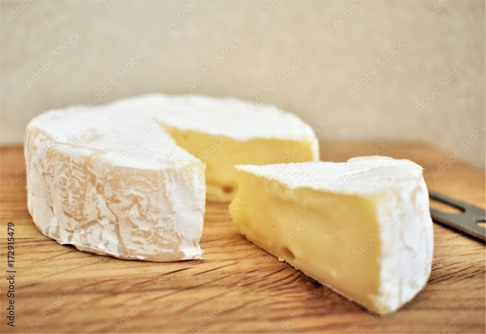 Camembert cheese sliced, closeup.