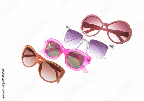 Fashionable four sunglasses on white background