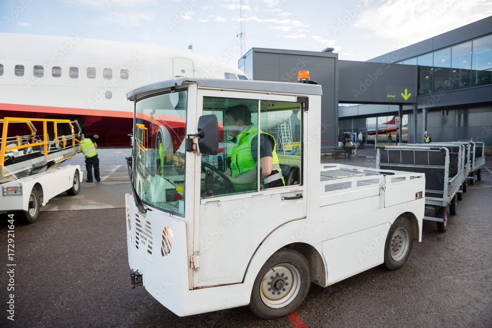 Worker Driving Vehicle On Runway