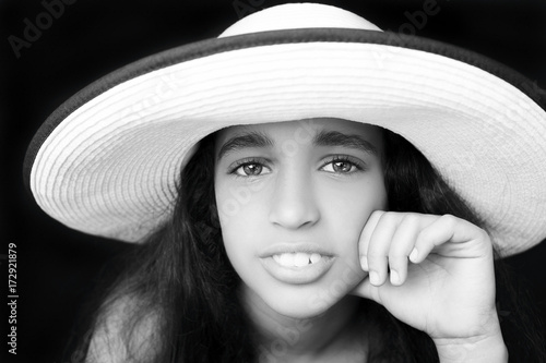 Portrait of a young african american girl  with sun hat