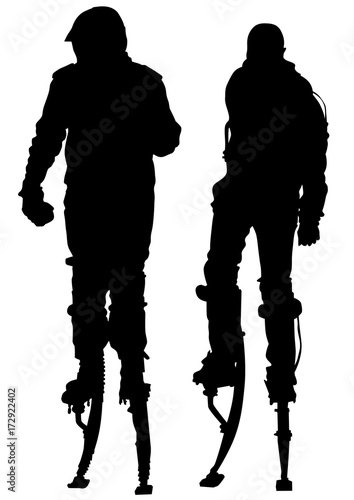 Athletic man on stilts on a white background