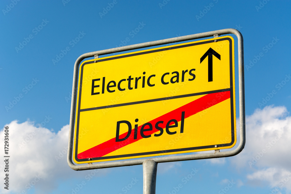 Yellow street sign with electric cars ahead leaving diesel behind Yellow street sign with electric cars ahead leaving diesel behind
