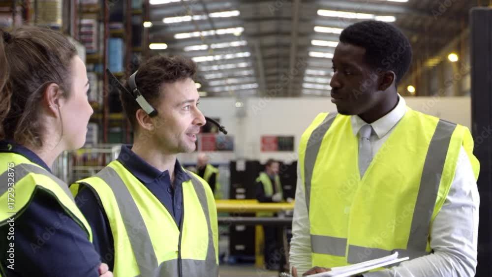 Casual conversation between staff in warehouse, shot on R3D Casual conversation between staff in warehouse, shot on R3D