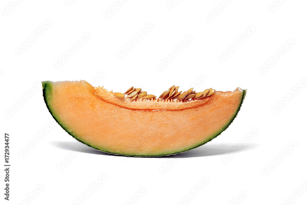 Pieces of orange Melon or cantaloupe fruit show flesh and seeds on white background.