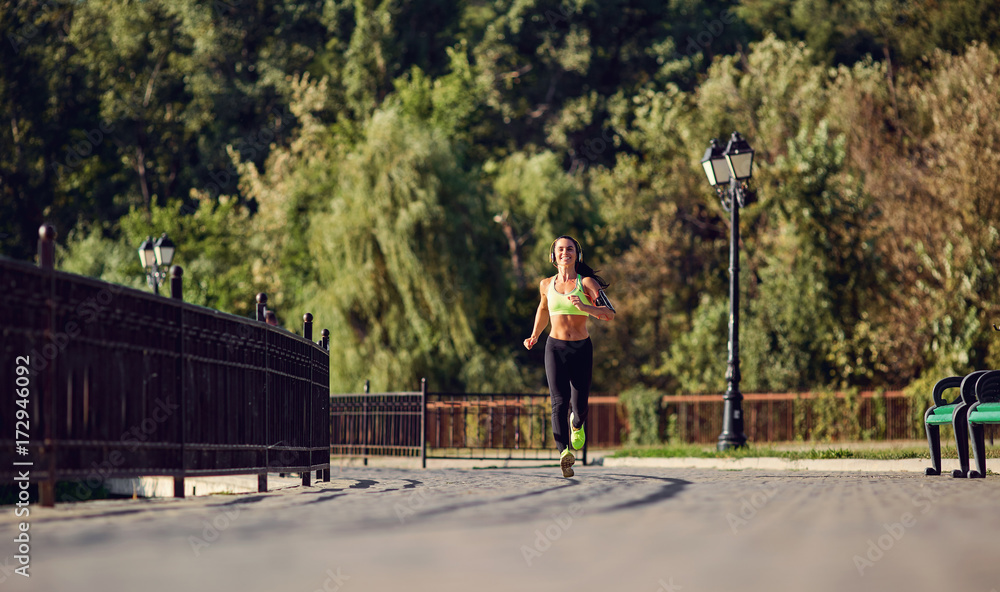 A girl jogging in the park. Healthy lifestyle. A girl jogging in the park. Healthy lifestyle.