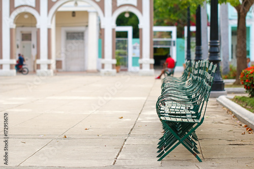 Empty benches in the square of Cienfuegos