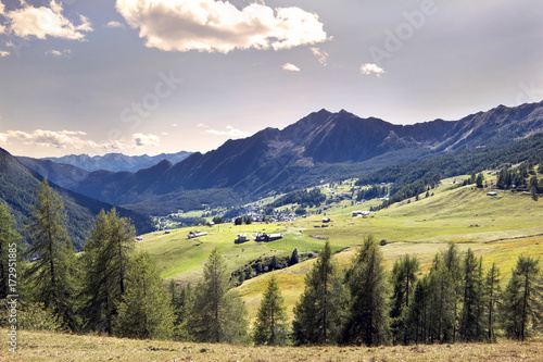 Paesaggio alpino con sullo sfondo il paesino di Antagnod. photo