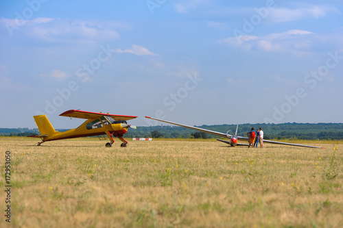 Sailplane and a towing aircraft starting on an airfield