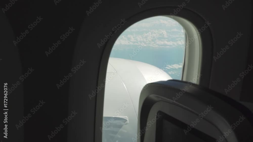 A window with cloud backdrop from a plane A window with cloud backdrop from a plane