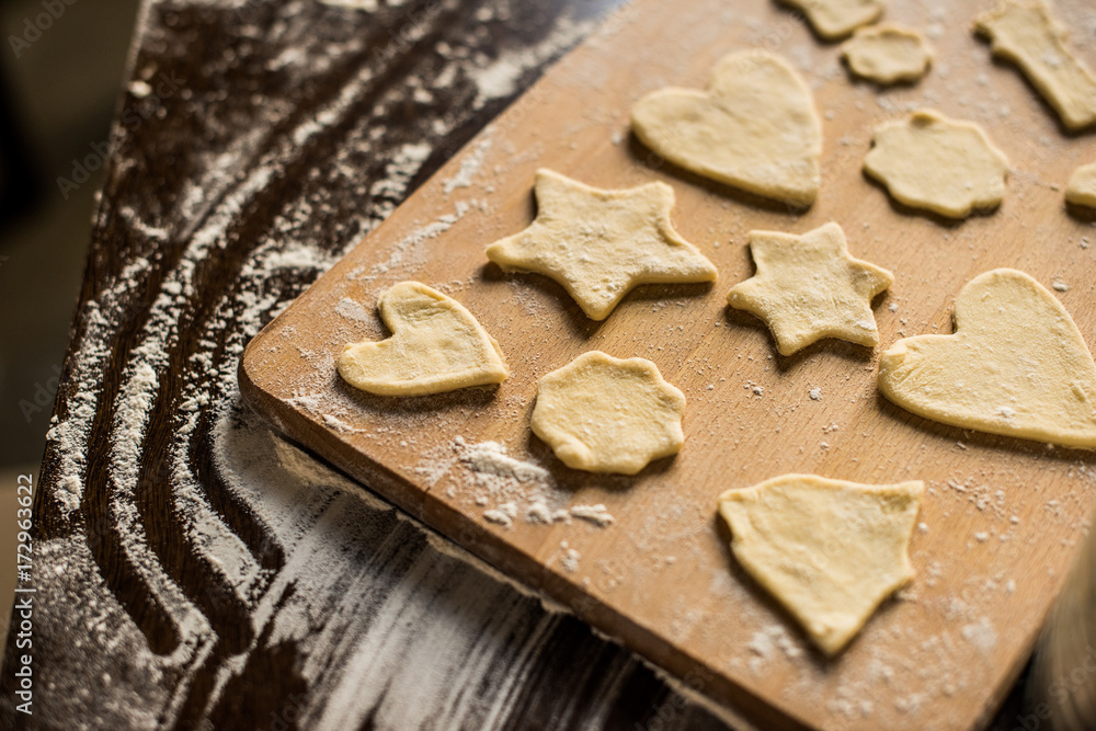 raw cookies on cutting board raw cookies on cutting board