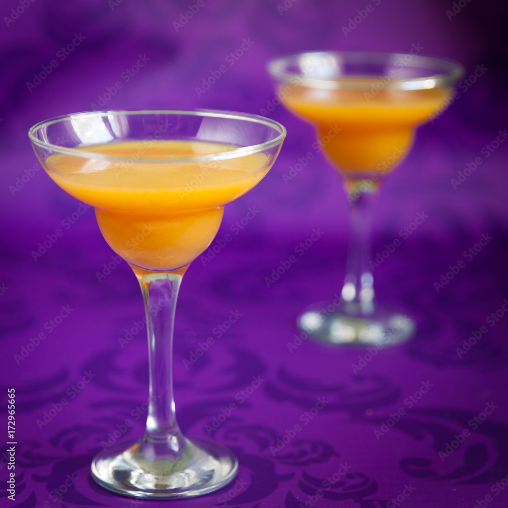 Peach jelly on vibrant violet background