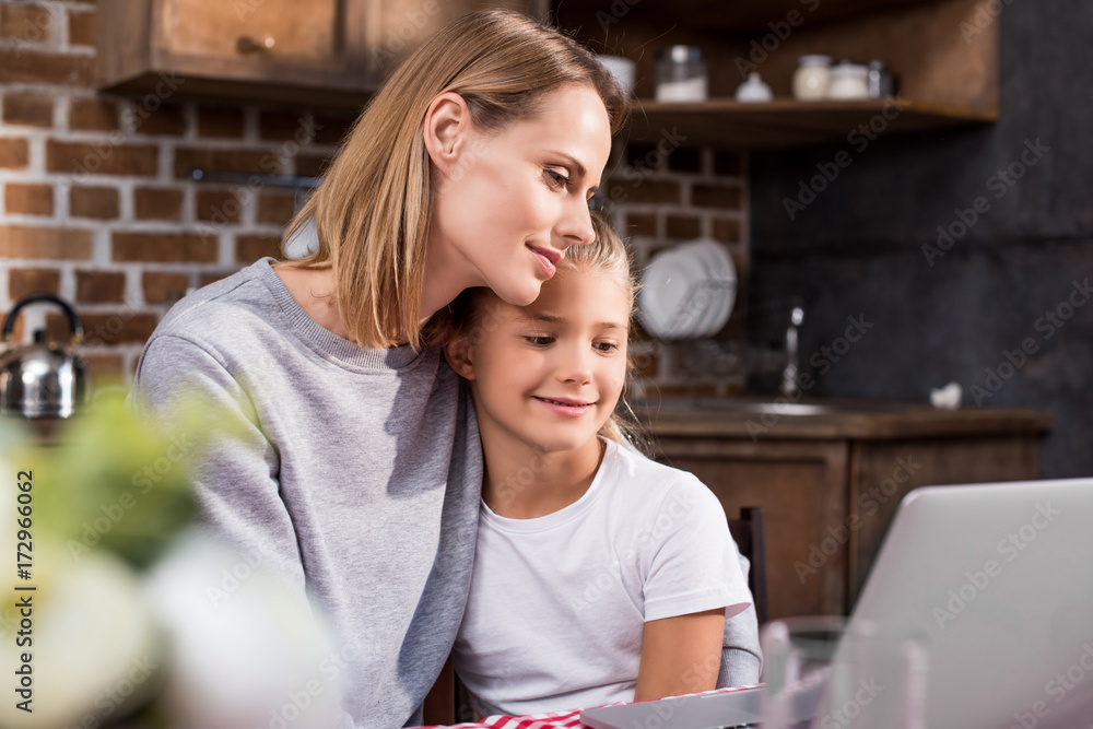 family using laptop family using laptop