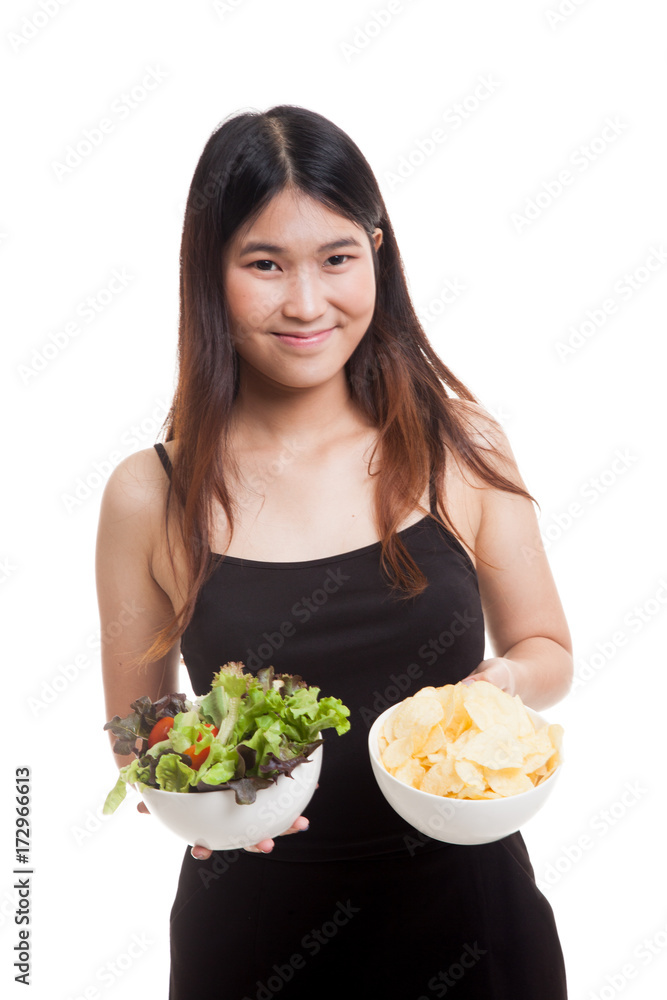 Young Asian woman with potato chips and salad. Young Asian woman with potato chips and salad.