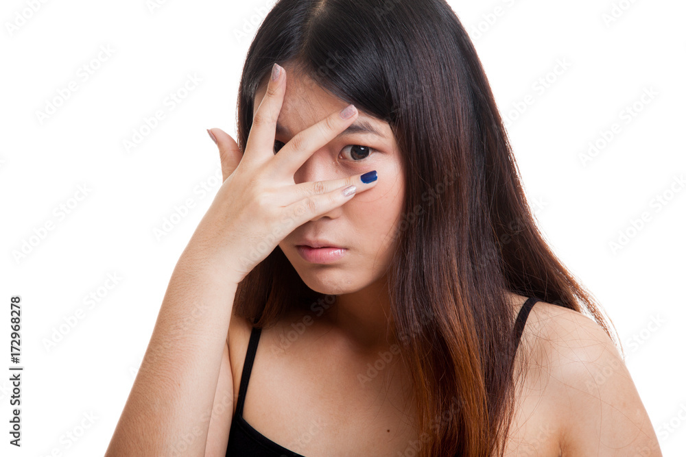 Beautiful young Asian woman peeking through fingers. Beautiful young Asian woman peeking through fingers.