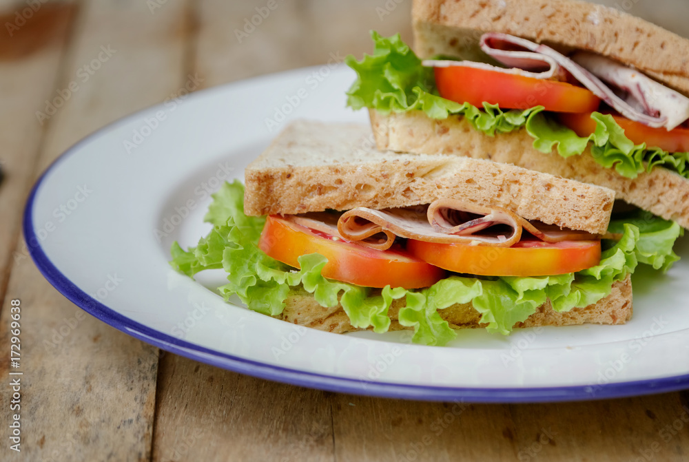 Fresh homemade club sandwich with lettuce and tomato Fresh homemade club sandwich with lettuce and tomato