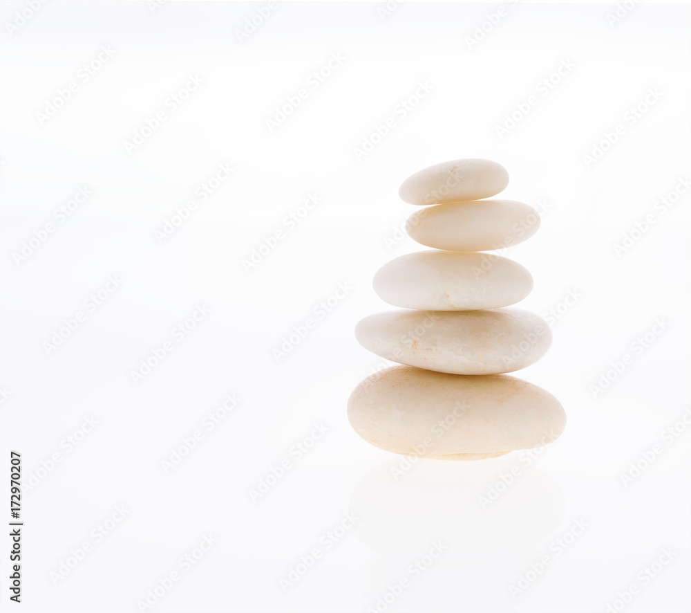 Balancing a stack of zen stones isolated on a white background Balancing a stack of zen stones isolated on a white background