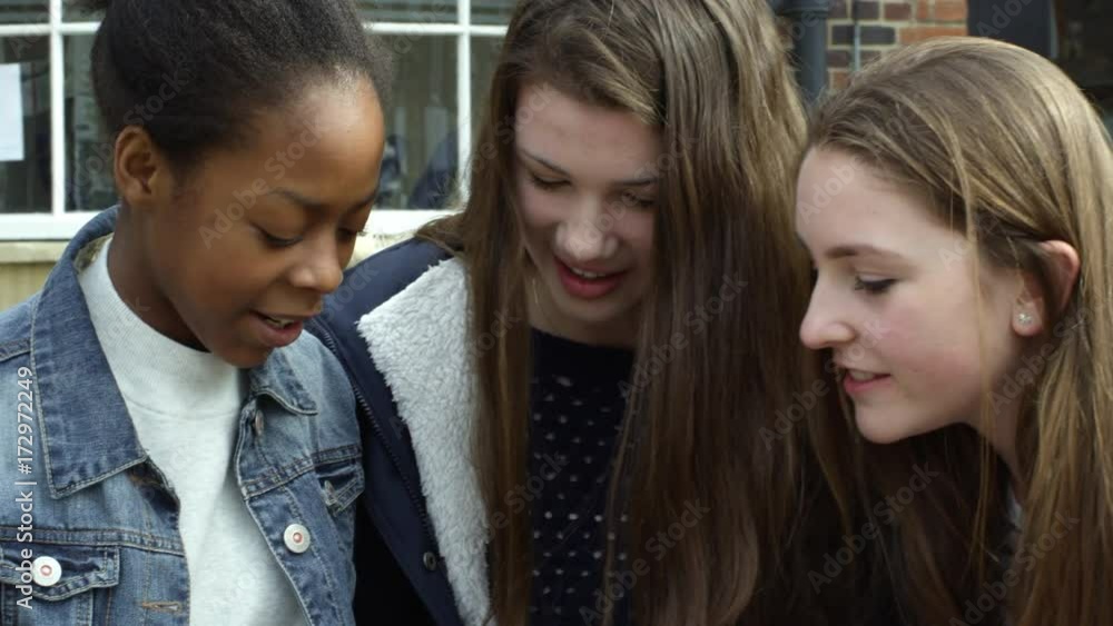Teenage Girls Using Mobile Phones In Town Shot On R3D Teenage Girls Using Mobile Phones In Town Shot On R3D