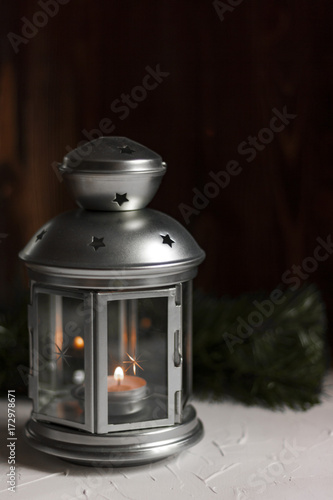 Christmas lantern on vintage wooden background in night