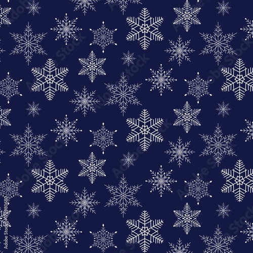Christmas pattern with snowflakes on blue background. Vector illustration 