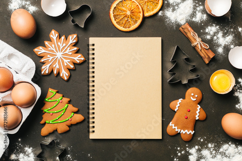 Xmas baking or cooking background. Ingredients, kitchen items for baking cookies. Kitchen utensils, flour, eggs and sugar. Text space, top view.