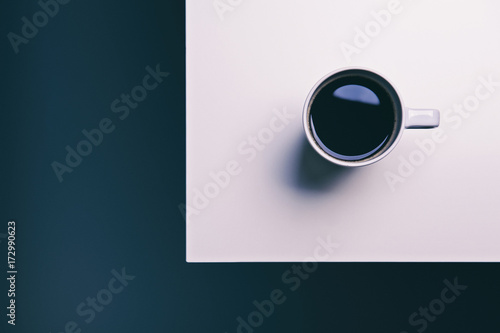 cup of coffee on a black and white geometric background