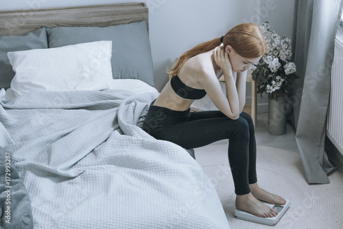 Underweight red hair woman photo