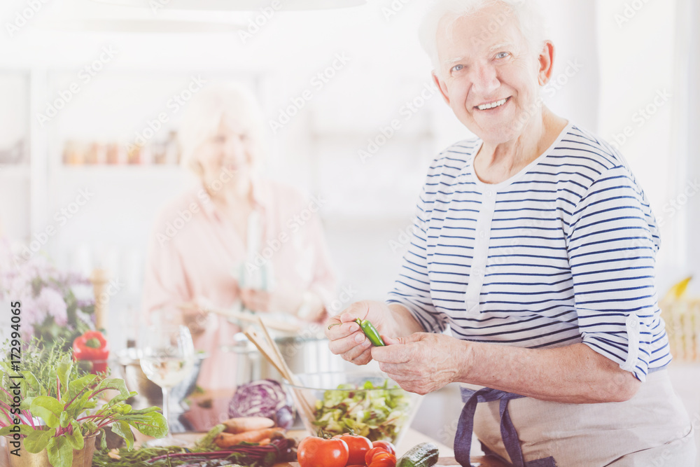 Smiling elder man in striped shirt Smiling elder man in striped shirt