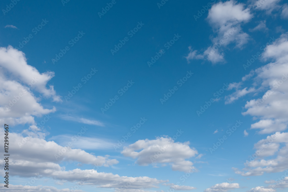 Fototapeta premium White clouds and blue sky. Blue sky with clouds over horizon.