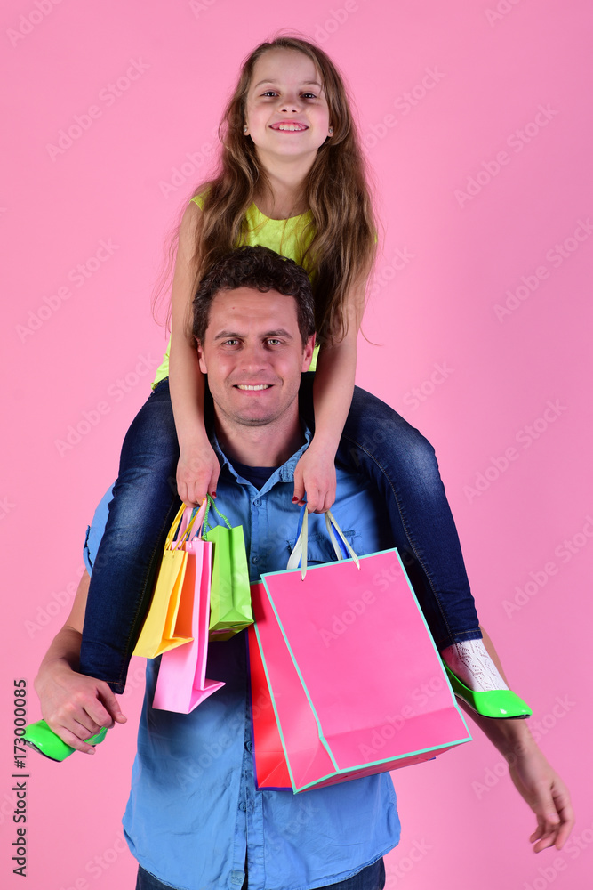 Shopping, presents and family concept. Daughter and father with packages Shopping, presents and family concept. Daughter and father with packages