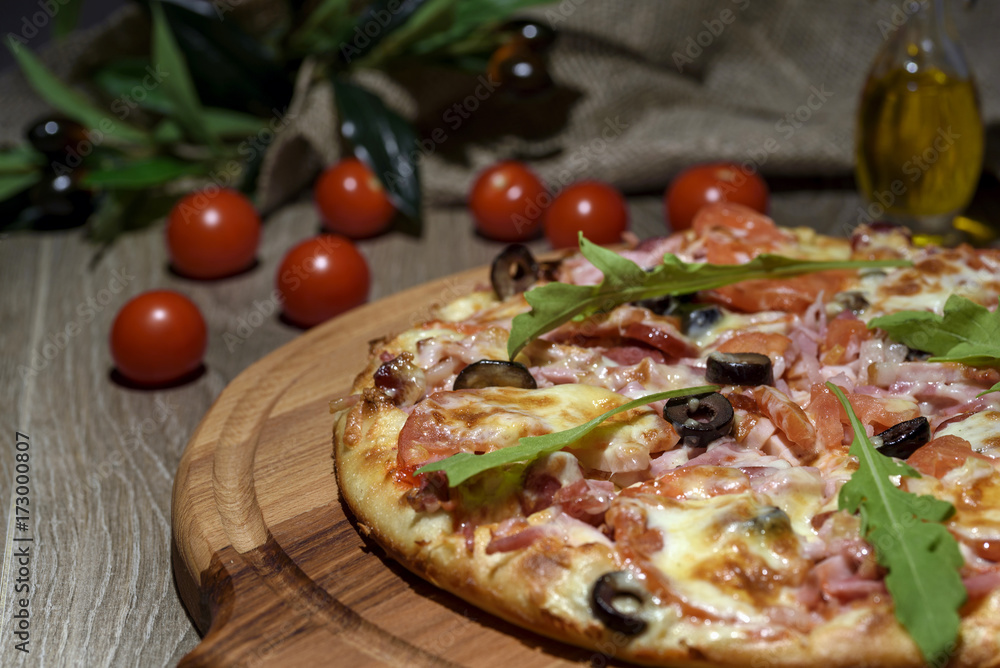 Delicious fresh pizza served on wooden table Delicious fresh pizza served on wooden table
