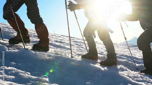 Climbers in crampons coming up to the summit of Elbrus. silhouette over extremely exposed area