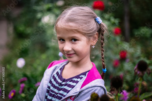 Portrait of a little girl in the garden