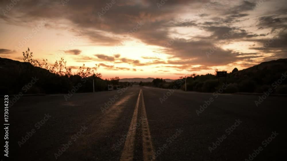 Joshua Tree Sunrise Time Lapse of Clouds above Desert Highway Joshua Tree Sunrise Time Lapse of Clouds above Desert Highway