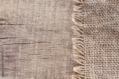 Burlap textureon a wooden background, rustic, christmas . Pattern  fabric textile. Texture background photo