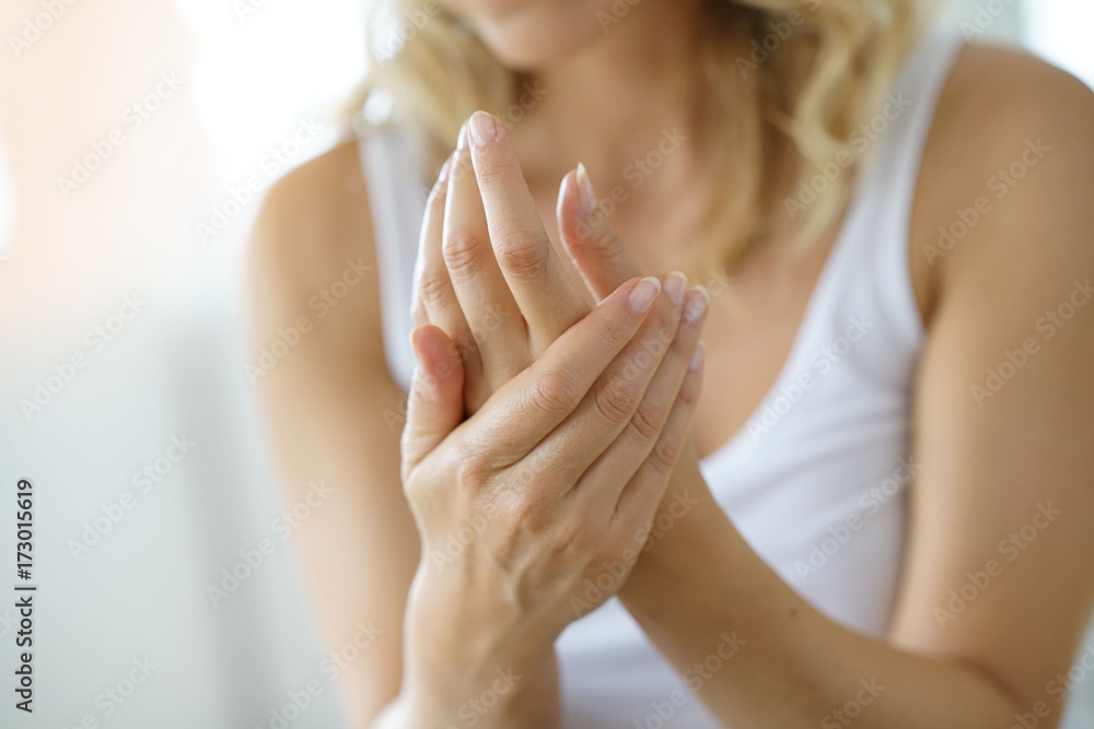 Closeup on woman's hands applying moisturizing hand-cream on Closeup on woman's hands applying moisturizing hand-cream on
