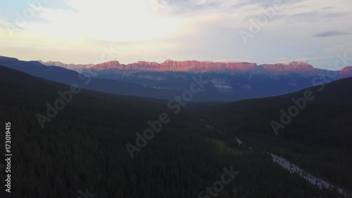 Sunset over valley with Moraine Creek, Banff National Park, Canada photo