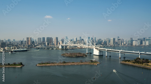 Tokyo Bay with a view of the Tokyo skyline and Rainbow Bridge in tokyo, Japan.