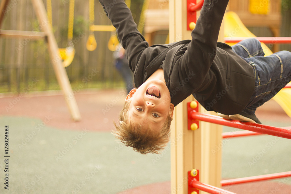 Fototapeta premium young boy playing on the Playground