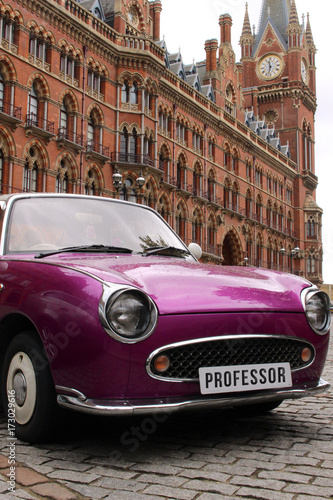Antique British Car with European City Architecture Building © Adam