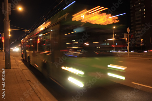 Motion blurred bus./The motion of a blurred bus in the street in the evening 