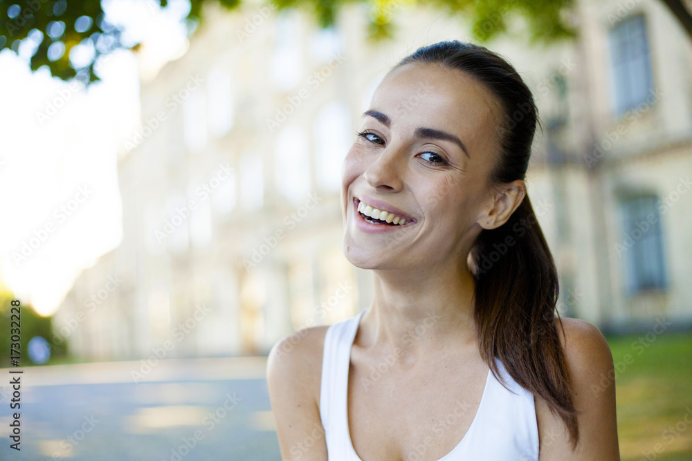 Portrait of a young beautiful brunette woman in park. Portrait of a young beautiful brunette woman in park.