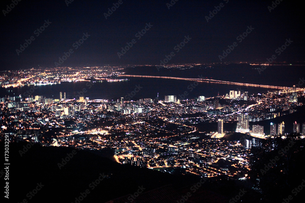 Amazing Cityscape Penang downtown at night, from the top of view on skyscraper, show lighting on the road of communication concept.