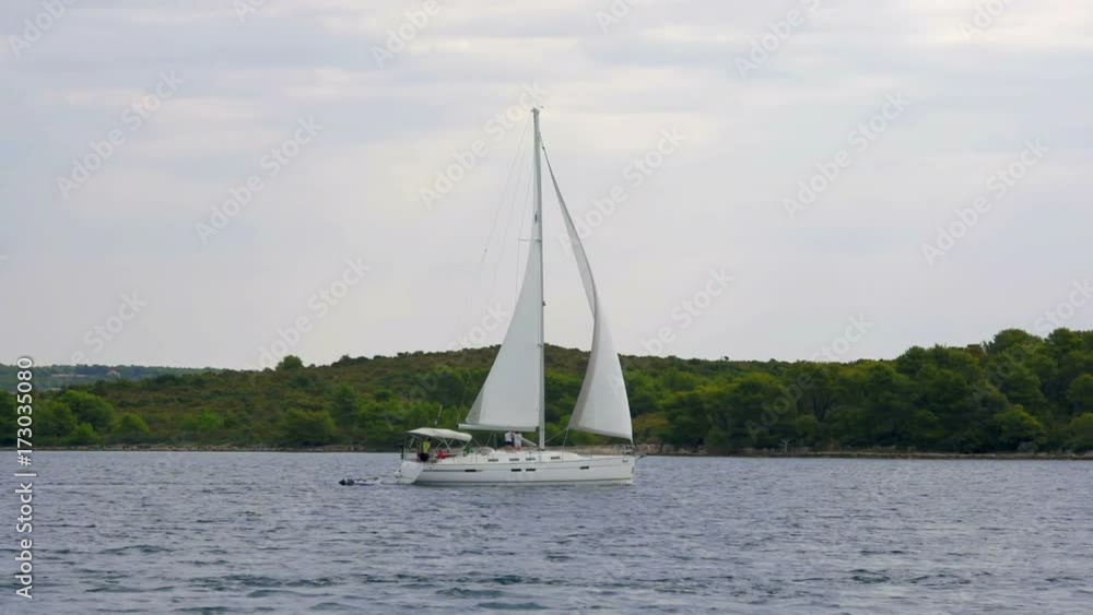 PASMAN, ISLAND PASMAN, CROATIA, 2017.08.22: Sailin boat sailing by town Pasman in slow-motion hd PASMAN, ISLAND PASMAN, CROATIA, 2017.08.22: Sailin boat sailing by town Pasman in slow-motion hd