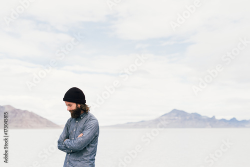 Young man by lake photo