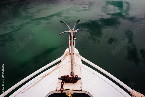 Bow of a small boat with anchor
