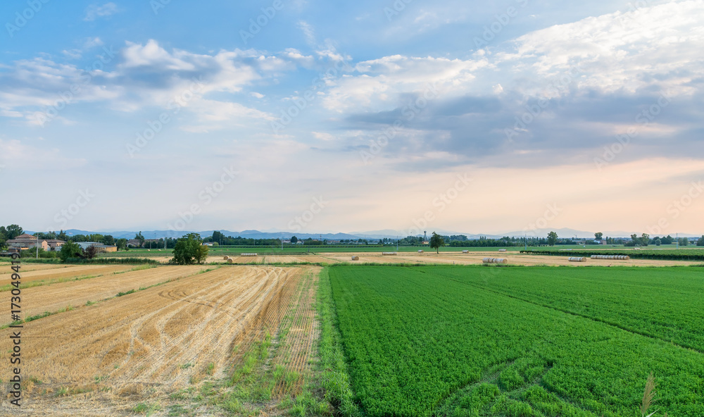 Pianura padana landscape at sunset with a dramatic sky