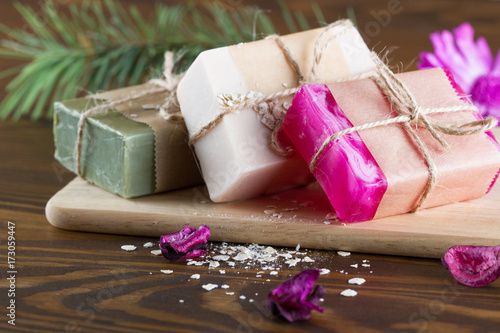 Natural handmade soap on wooden table photo