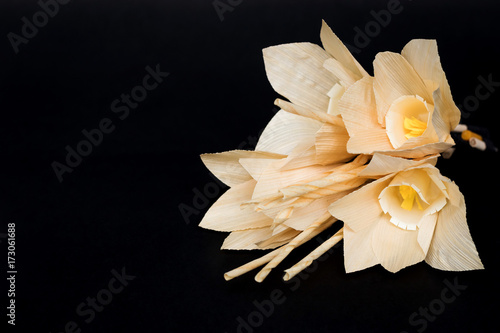 Fototapeta Naklejka Na Ścianę i Meble -  Kind of wood flower isolated on black background; to be placed on the site of cremation in Thailand. (Dok Mai Jan)